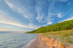 Landscape of the shoreline of Lake Michigan with beautiful clouds near sunset, Sleeping Bear Dunes National Lakeshore, Michigan, USA