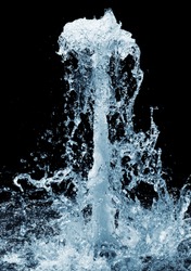 Fragment of a waterfall isolated on the black background