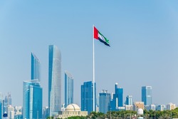 Detail of skyscrapers in Abu Dhabi with the local flag, UAE