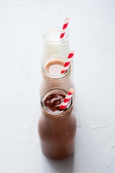 Three Different Sorts Beverage Milk Cocoa Chocolate Bottle Grey Background Top View