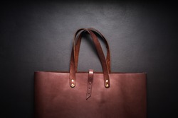 Elegant Luxury Leather Brown Bag Black Background Rich Accessories One Object Flat Lay Top View Sales Fashion Concept