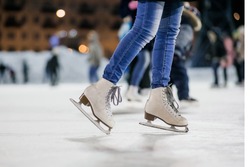 the girl on the figured skates on a opened skating rink