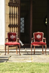 Romanian royal heraldry is seen on two royal chairs