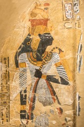 Ancient Egyptian illustration and hieroglyphs engraved and painted on a old stone  