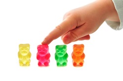 Four of colorful gummy bears on white background
