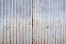 Abstract tin texture with rust and vertical lines. An old metal material texture for your design.