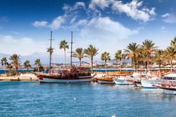 Port with sightseeing boats, beautiful scenery, Resort town Side in Turkey