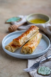 Fried filo dough rolls filled with blue cheese