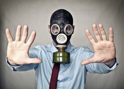 businessman with gas mask stop posture