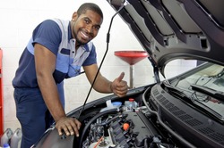 Good Looking Mechanic Giving Thumbs Up And Smiling
