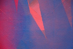 Street art. Colorful graffiti on the wall. Fragment for background. Vivid color. Abstract graffiti on the wall. Pink and blue color