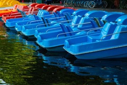 colorful pedal boats for hire in the English Garden in Munich, tourism