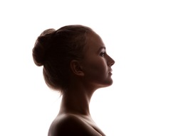  woman portrait profile  in silhouette shadow on studio isolated white background