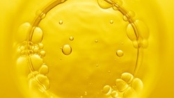 Top view macro shot of violed liquid in beaker with bubbles on yellow background | Abstract face care cosmetics formulation concept