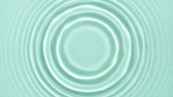 Top view of water circles on light green background | Beauty products background
