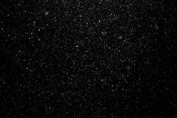 Falling real snowflakes, heavy snow, shot on a black background, frosted, wide-angle, insulated, ideal for digital composition, post-production.
