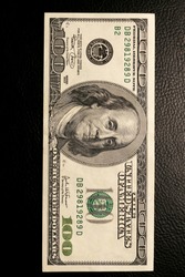 close-up of dollar bills on black background studio