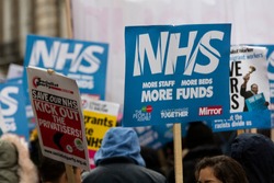 LONDON, UK - February 3rd 2018: Protesters and campaigners on a save the NHS march in central London