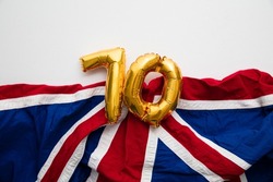 Number 70 balloons on a united kingdom union jack flag