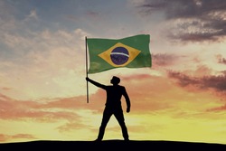 Male silhouette figure waving Brazil flag. 3D Rendering