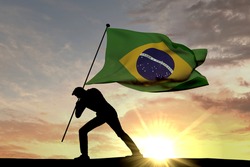 Brazil flag being pushed into the ground by a male silhouette. 3D Rendering
