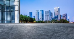 Panoramic skyline and modern commercial office buildings with empty road in Shenzhen, China. Asphalt road and cityscape.