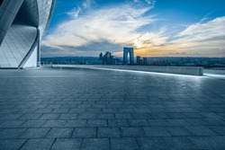 Empty floor and city skyline with modern building at sunset in Suzhou, China. high angle view.