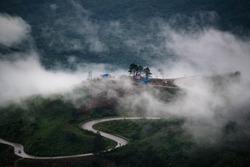 Nature Lighting Road in fog between road go to Phu Tabberk, Phetchabun Province, THAILAND.(Selective Focus)