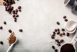 Background with assorted coffee, coffee beans, ground and instant, pads and capsules, retro style toned, copy space, top view.