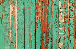 Turquoise cracked paint wooden wall background
