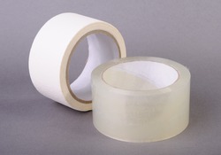 Rolls of tape on gray background.