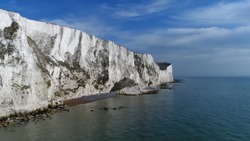 Aerial bird view picture of The White Cliffs of Dover they are cliffs that form part of the English coastline facing the Strait of Dover and France and are part of the North Downs formation