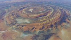High altitude view of the Richat Structure is a prominent circular feature in the Sahara's Adrar Plateau near Ouadane west central Mauritania in Northwest Africa 4k screenshot of animation