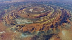 Aerial view of Richat Structure also called Guelb er Richât in Arabic Qalb ar-Rīšāt is geological feature in Sahara's Adrar Plateau westcentral Mauritania, Northwest Africa screenshot of animation