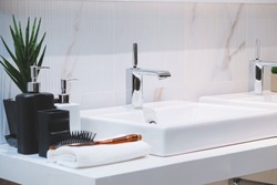 Interior of bathroom with sink basin faucet. Modern design of bathroom