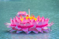 Beautiful pink kratong is floating on the water. Conccept for loy kratongs festival celebrated in Thailand.