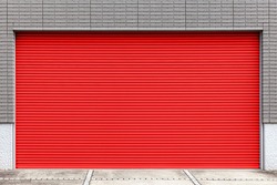Automatic red roller shutter doors on the ground floor of the house