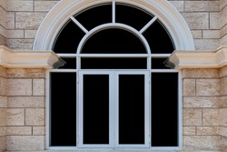European white aluminum window frame and brown stone wall