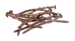 Macro of pile of rusty nails isolated against white