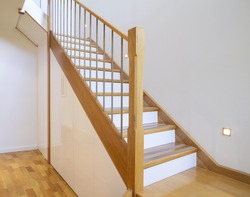 European Oak staircase with white risers in a contemporary architect designed home