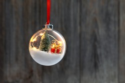 Clear Ball Ornament  with christmas tree,  small gift and christmas light inside.