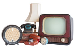 Old household items: TV, radio, camera, alarm, phone, table lamp, suitcase.   Old household items isolated on white background. 