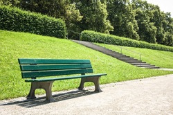 wooden park bench at a park