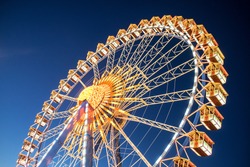 famous ferris wheel at the oktoberfest in munich - germany