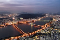 Awesome evening aerial view of the Han River (Hangang) in Seoul, South Korea. Amazing cityscape. Seoul is a popular tourist destination of Asia.