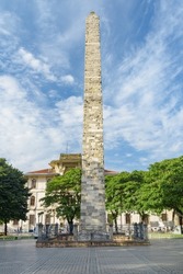 Awesome view of the Walled Obelisk (Constantine's Obelisk) in Sultanahmet Square of Istanbul, Turkey. Marmara University is visible in background. The roman monument is a popular tourist attraction.
