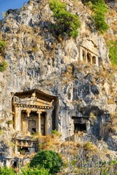 View of the Tomb of Amyntas in Fethiye, Turkey. The Lycian Rock Tombs at ancient Telmessos currently in Fethiye is a popular tourist attraction in Turkey.