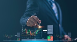 planning analyze indicator and strategy buy and sell, Stock market, Business growth, progress or success concept. Businessman or trader is pointing a growing virtual hologram stock, invest in trading
