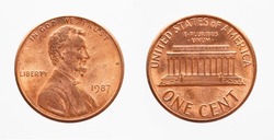 United States - circa 1987: a USA one cent coin showing the portrait of President Abraham Lincoln and the Lincoln Memorial building. Text: In god we trust 
