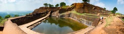 Panorama of a large reservoir of water and a large number of steps in the ancient ruins of the Lion's Rock. Sigiriya, Sri Lanka. high resolution.